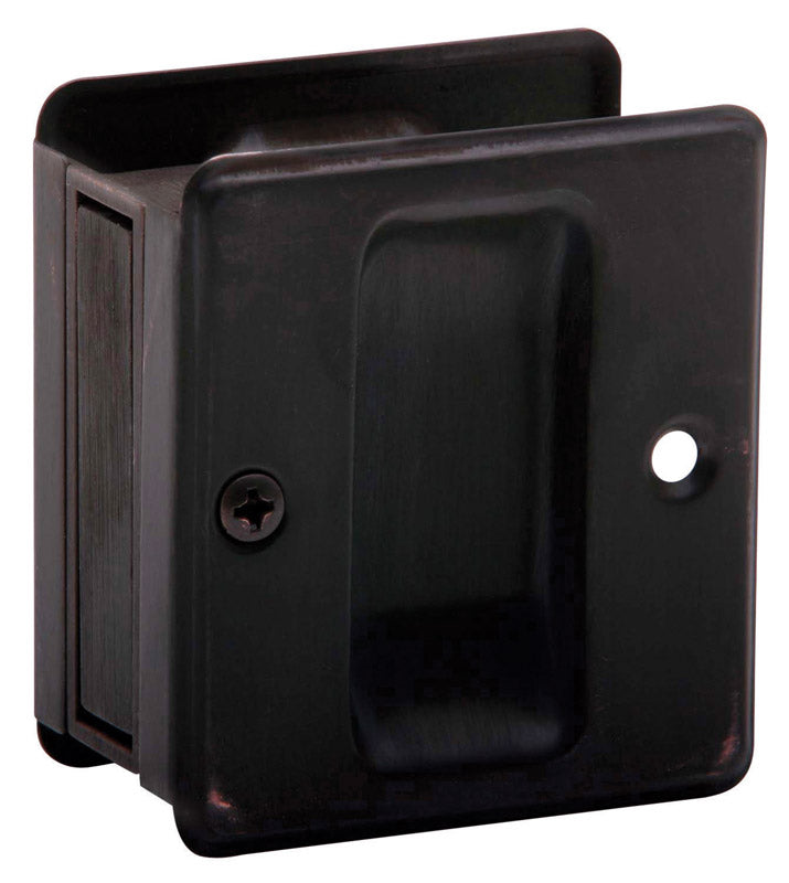 Tirador para puerta corredera Schlage de latón macizo con acabado bronce envejecido, 2,5 pulg. de diámetro × 2,25 pulg. de largo, 1 ud.